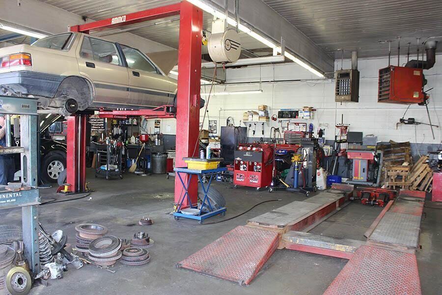 Skylight Auto Repair shop interior with vehicle on lift